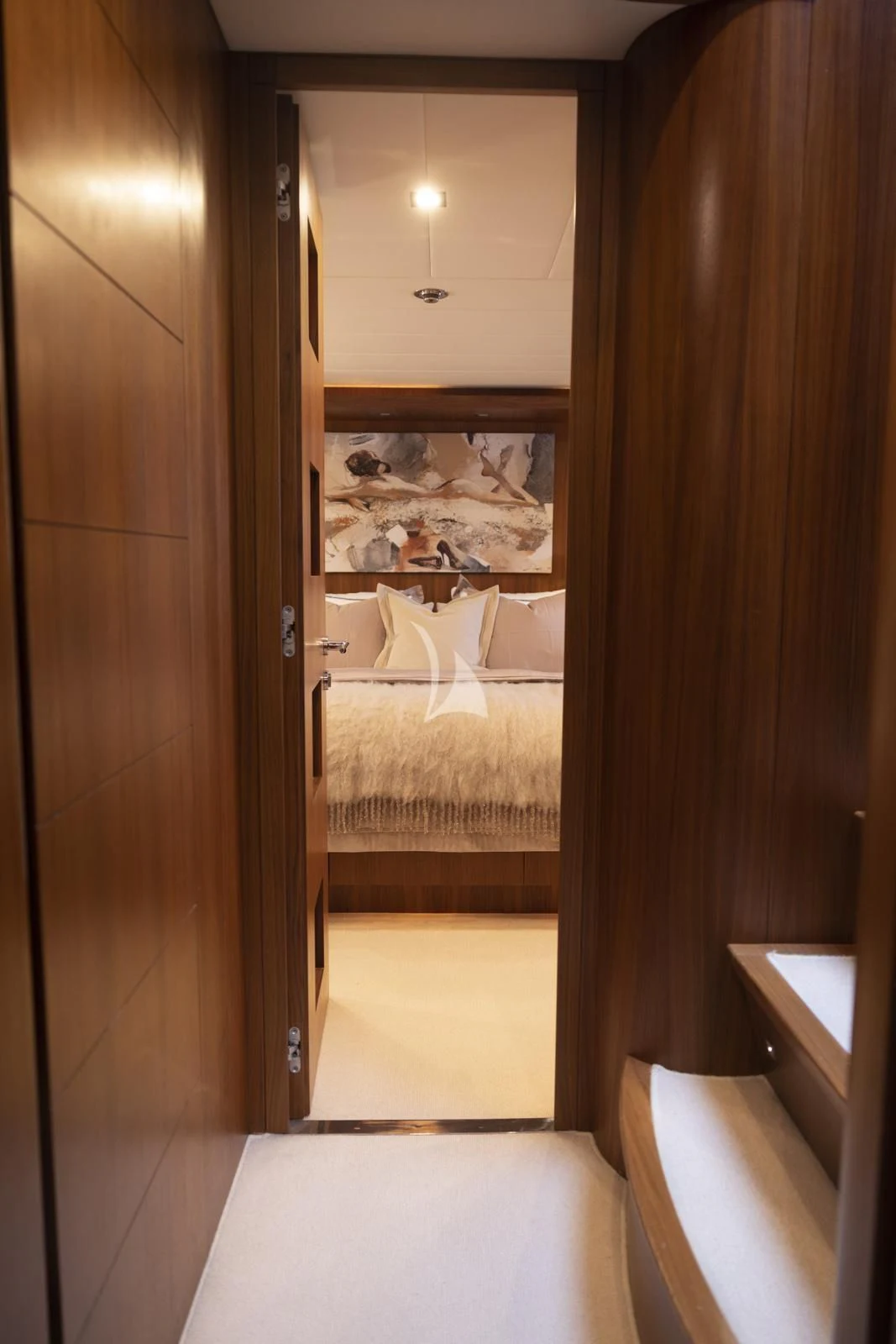 a room with a mirror and a bed in it aboard XUMI Yacht for Charter