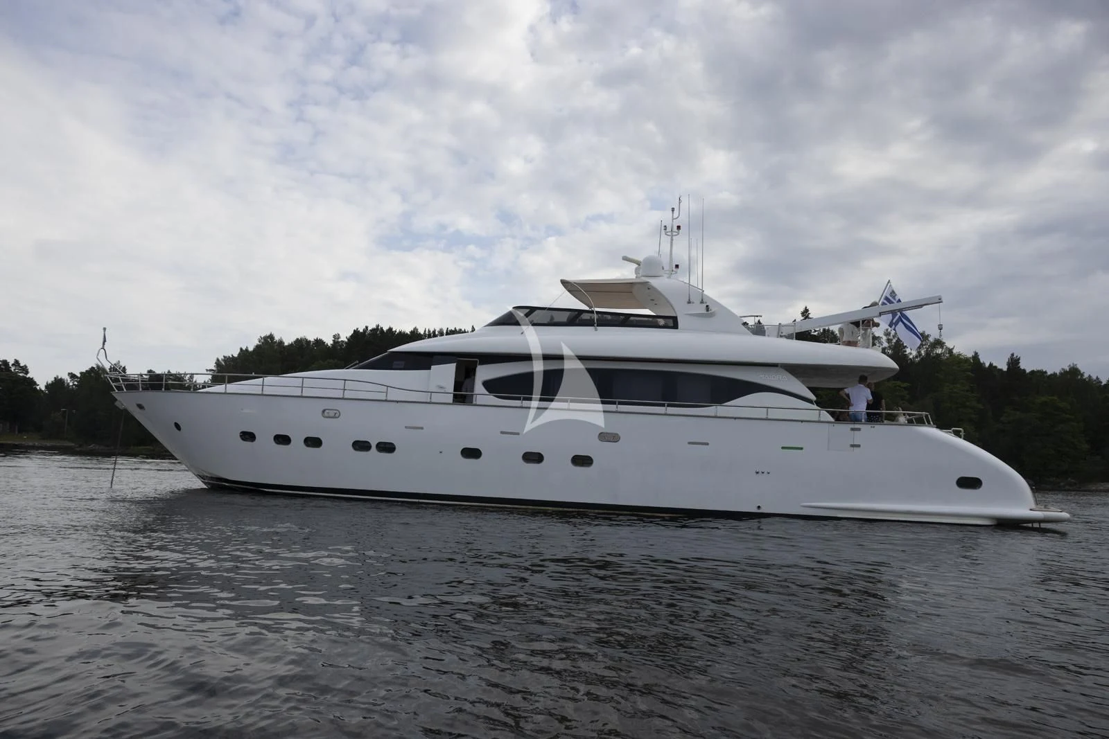 a white yacht on the water aboard XUMI Yacht for Charter