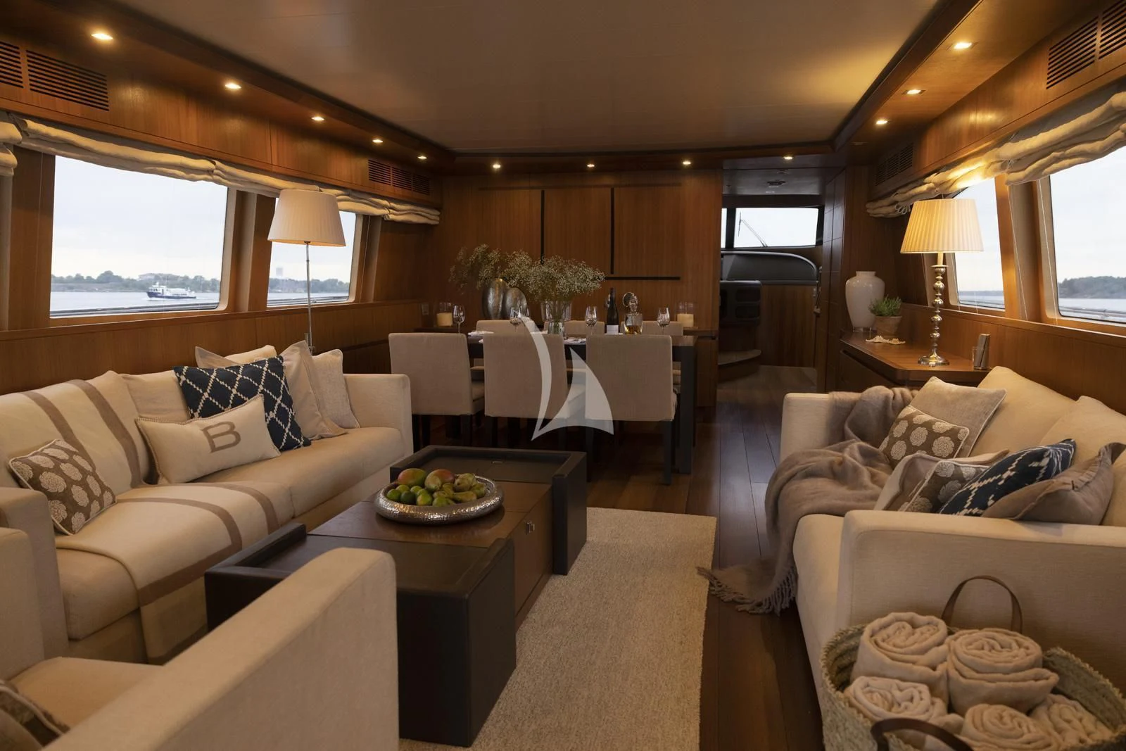 a living room with a couch and a table aboard XUMI Yacht for Charter
