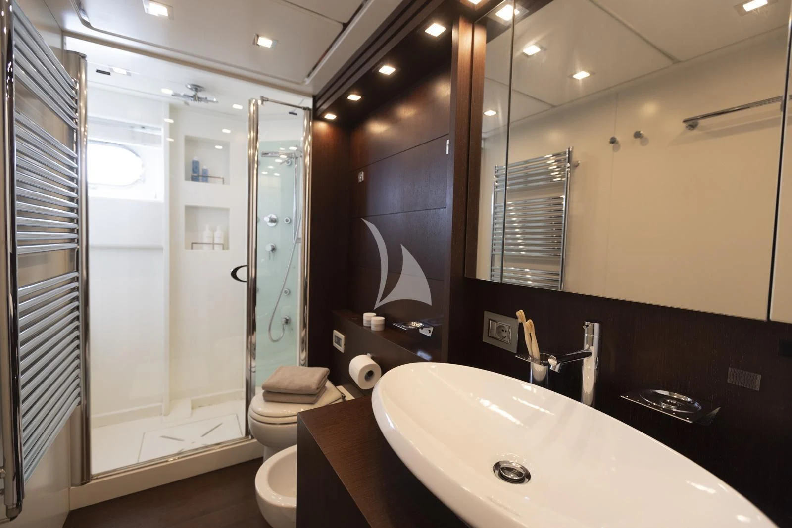 a bathroom with a large mirror aboard XUMI Yacht for Charter