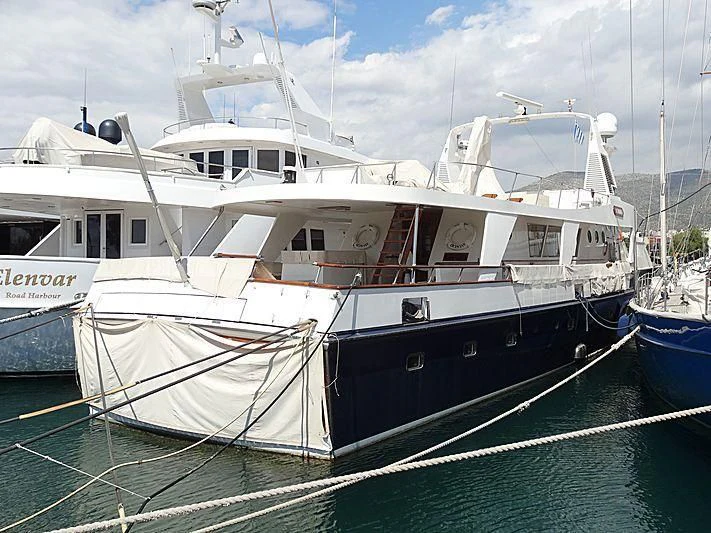 a boat tied to a dock aboard OCTAVIAN Yacht for Sale