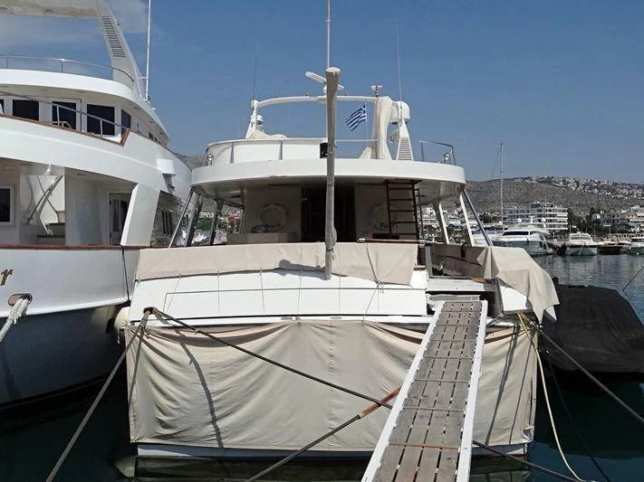 a boat docked at a pier aboard OCTAVIAN Yacht for Sale