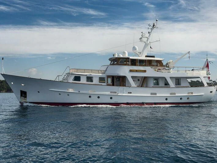 a large white boat in the water aboard FIVE ANGELS Yacht for Sale