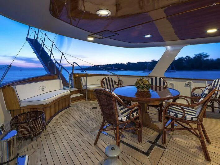 a room with a table and chairs aboard FIVE ANGELS Yacht for Sale