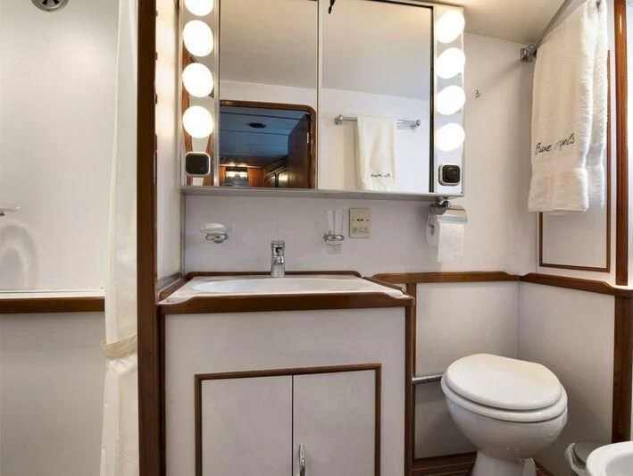 a bathroom with a sink and toilet aboard FIVE ANGELS Yacht for Sale