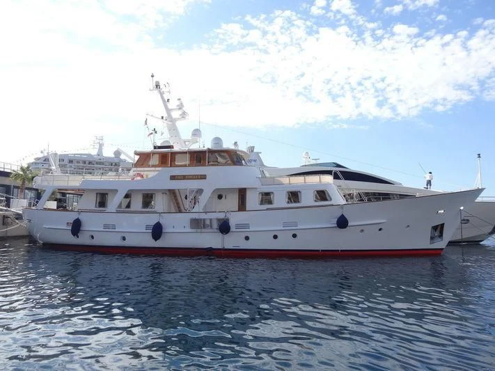 a large white boat in the water aboard FIVE ANGELS Yacht for Sale