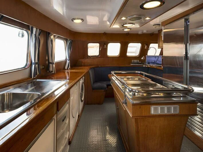 a kitchen with a large sink and cabinets aboard FIVE ANGELS Yacht for Sale