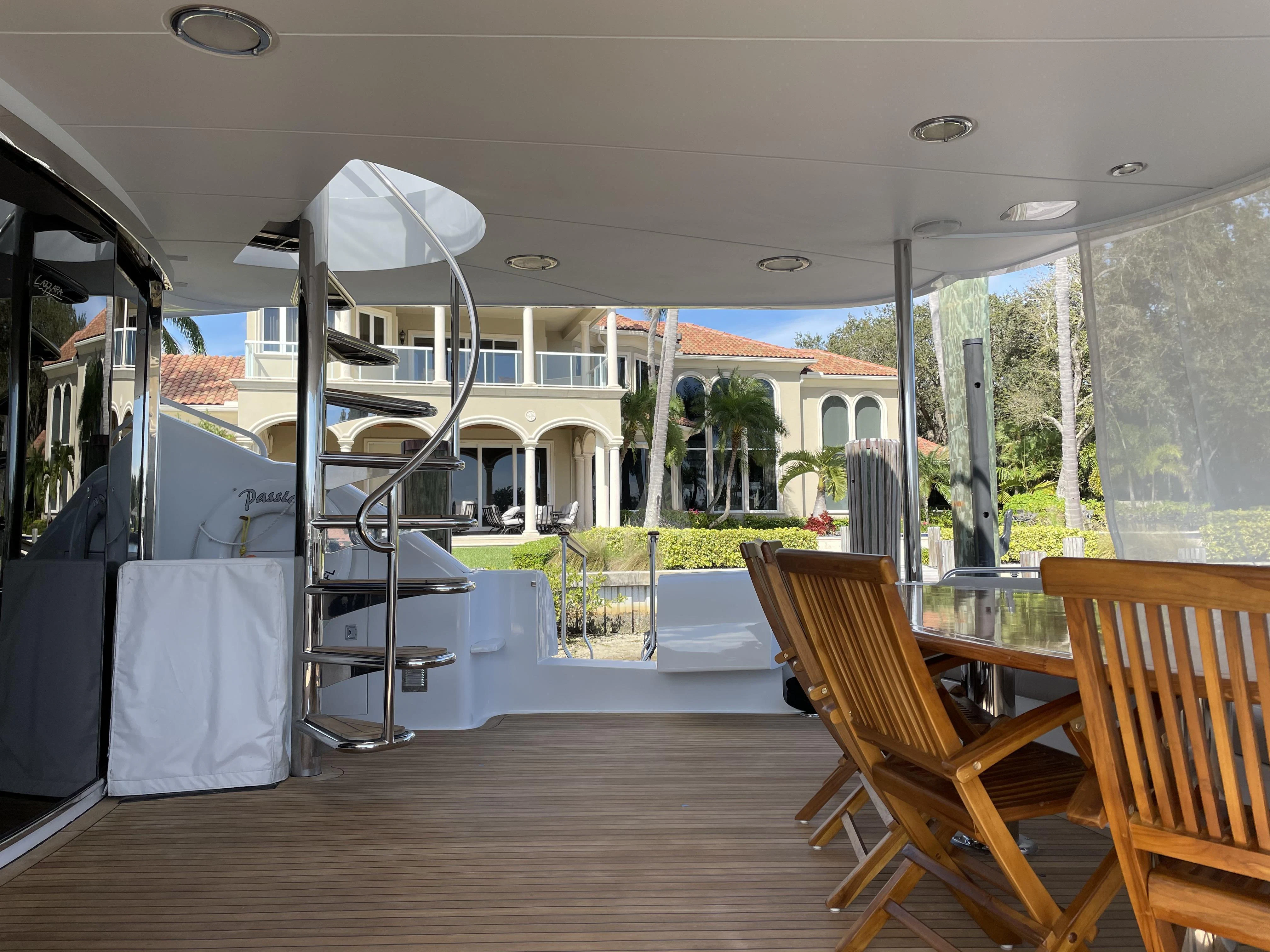 a room with a slide and chairs aboard CENTER RING Yacht for Sale