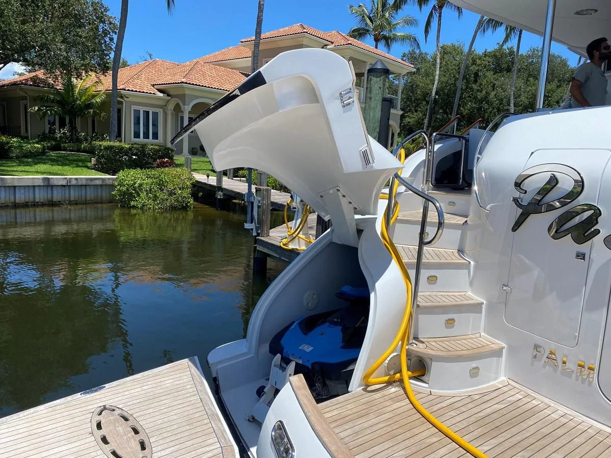 a white boat with a large white object on it aboard CENTER RING Yacht for Sale