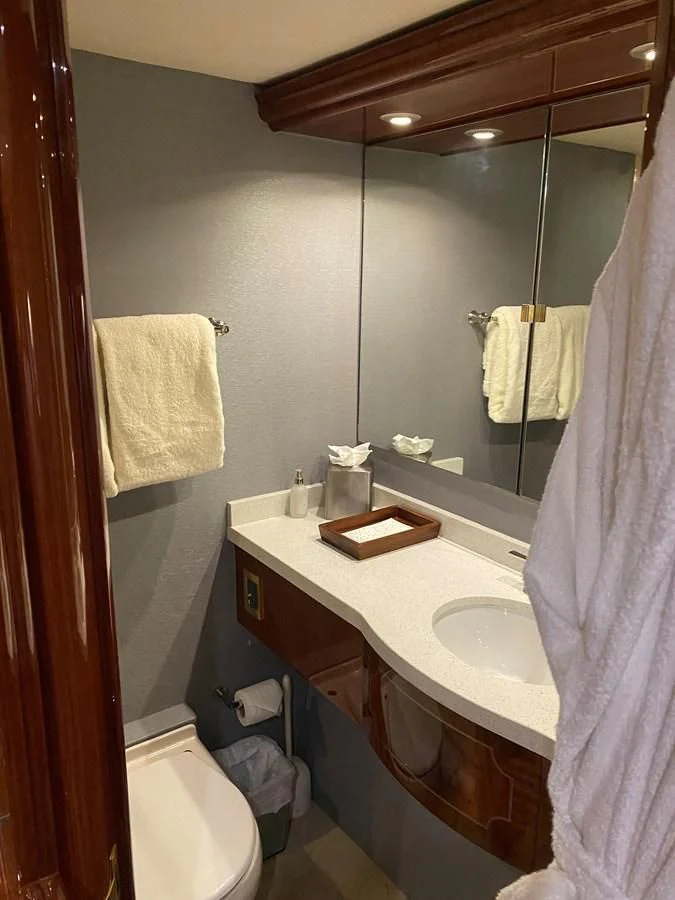a bathroom with a sink and a mirror aboard CENTER RING Yacht for Sale