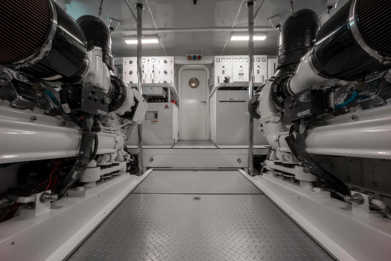 a room with white machines aboard CENTER RING Yacht for Sale