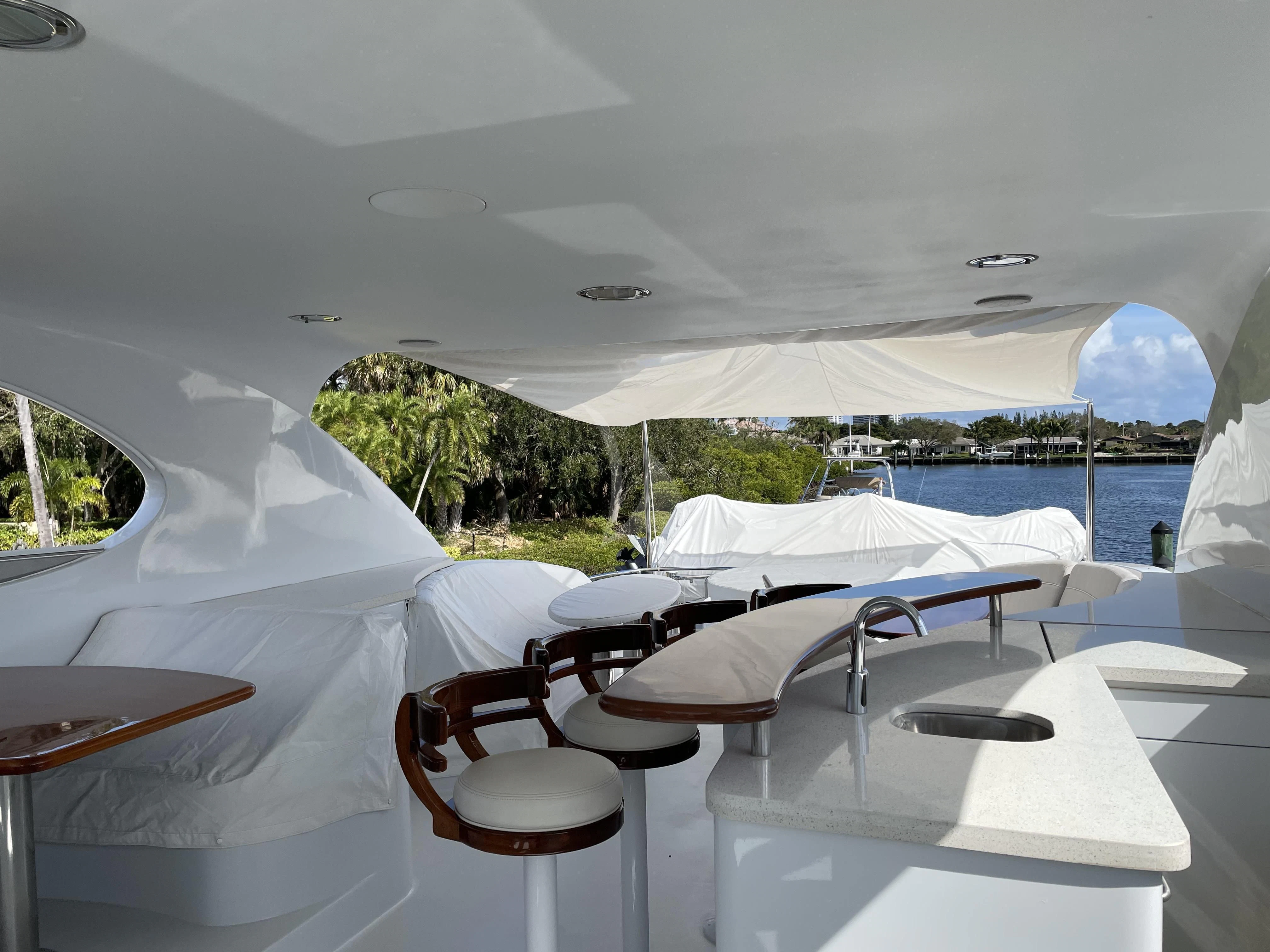 a room with tables and chairs aboard CENTER RING Yacht for Sale