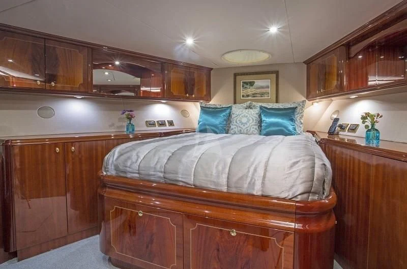 a bed in a room aboard CENTER RING Yacht for Sale