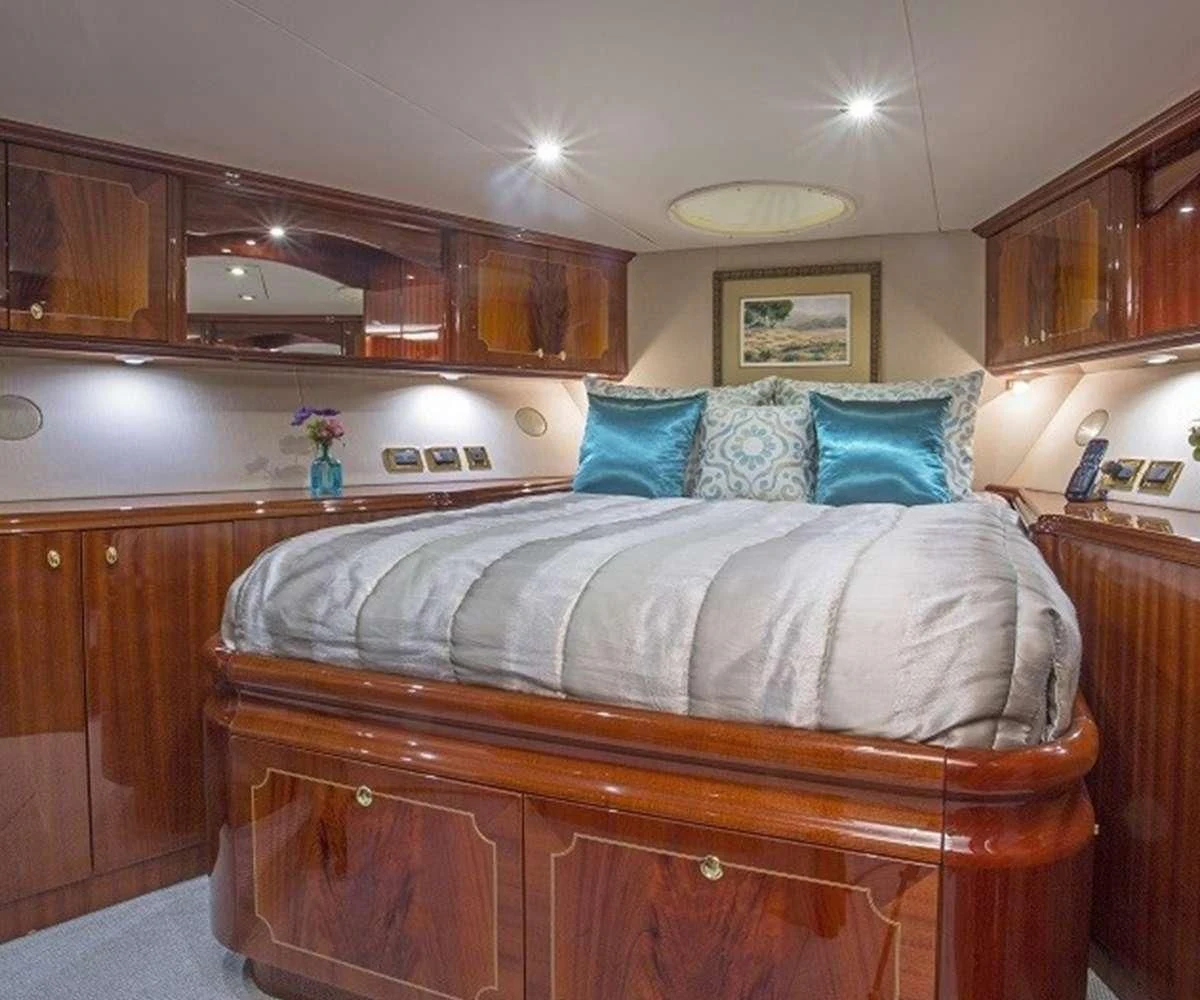 a bed in a room aboard CENTER RING Yacht for Sale