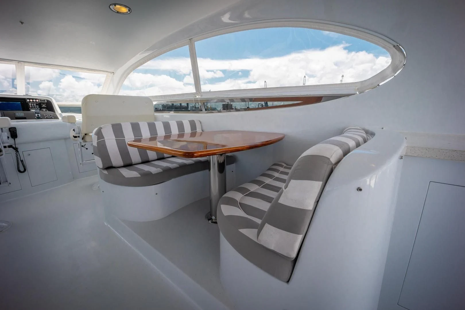 a room with a table and chairs aboard CENTER RING Yacht for Sale
