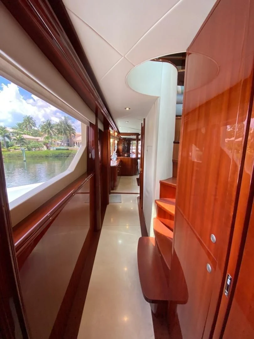 a hallway with a glass door aboard CENTER RING Yacht for Sale