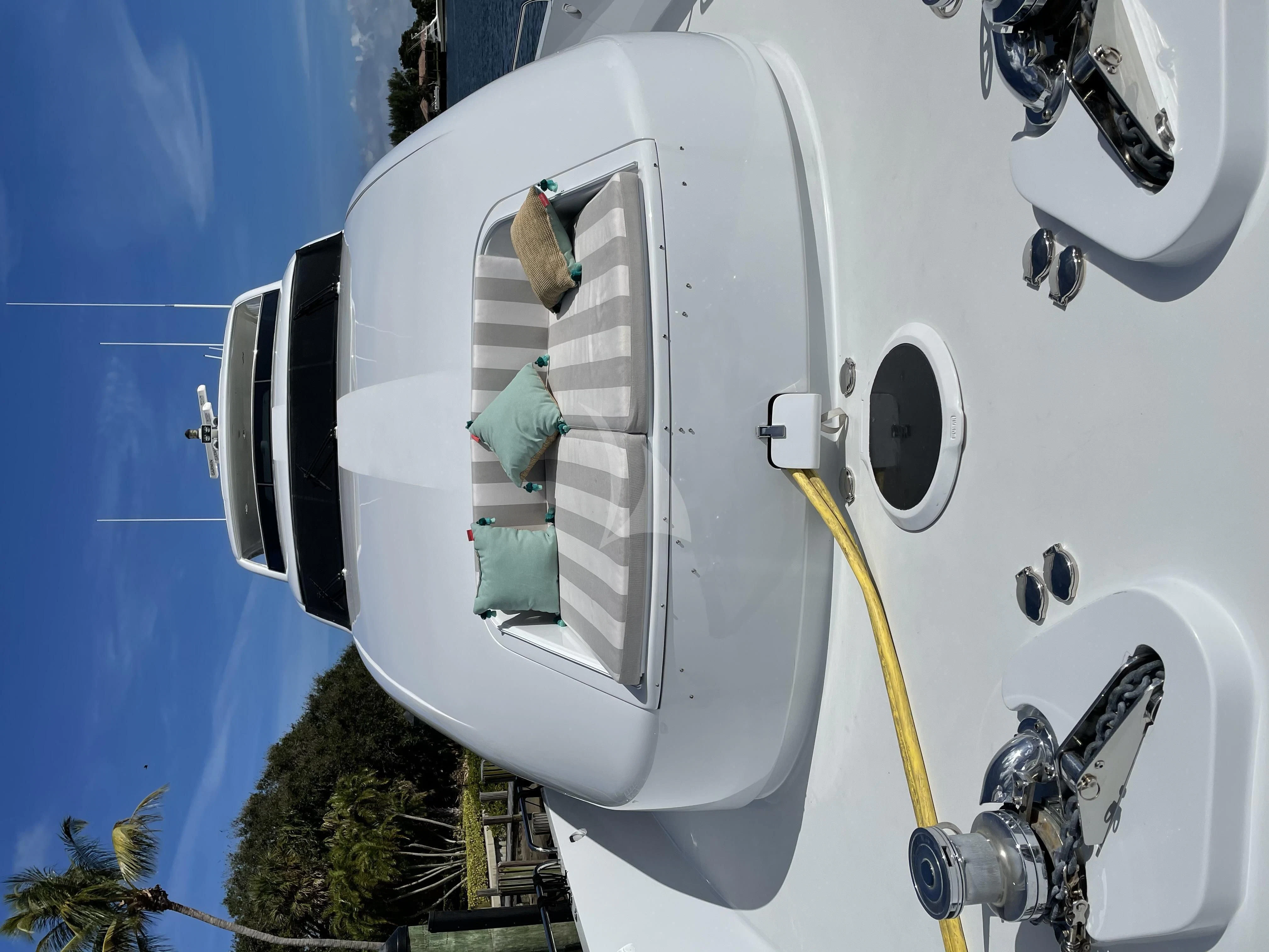 a person in a white vehicle aboard CENTER RING Yacht for Sale