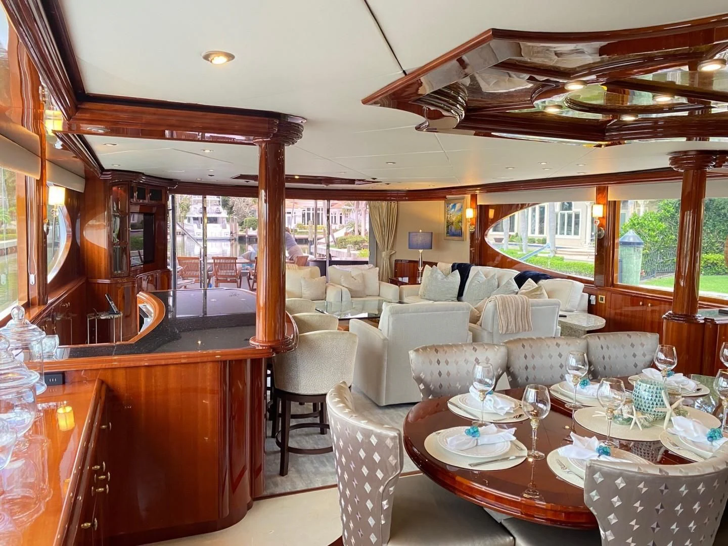 a dining room with a large window aboard CENTER RING Yacht for Sale