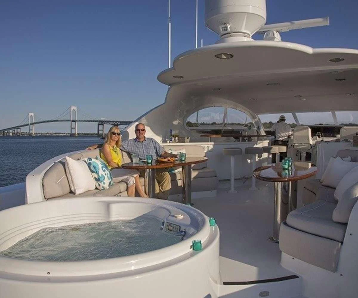 a couple sitting at a table on a boat aboard CENTER RING Yacht for Sale