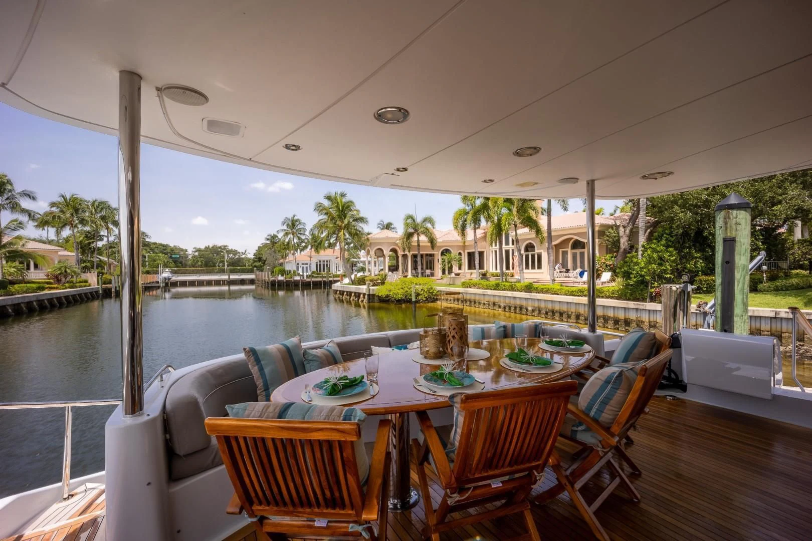 a table set for a meal on a patio aboard CENTER RING Yacht for Sale