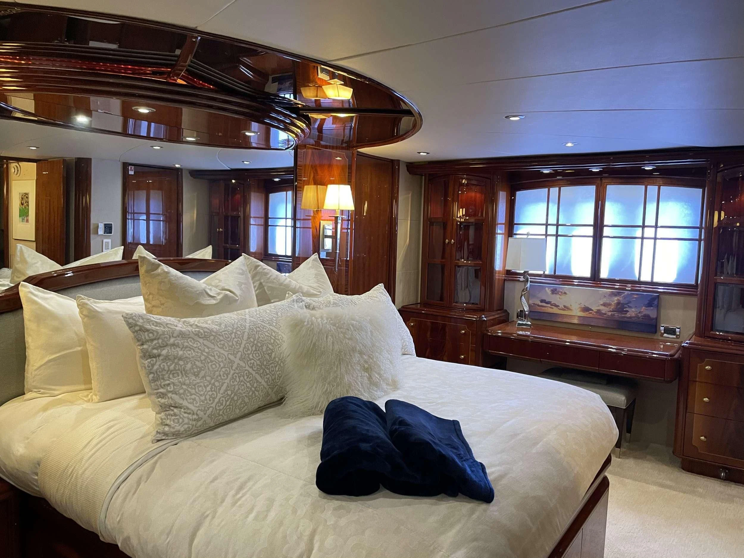 a large bed in a room aboard CENTER RING Yacht for Sale