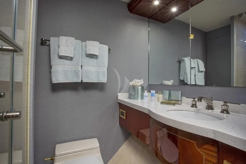 a bathroom with a large mirror aboard CENTER RING Yacht for Sale