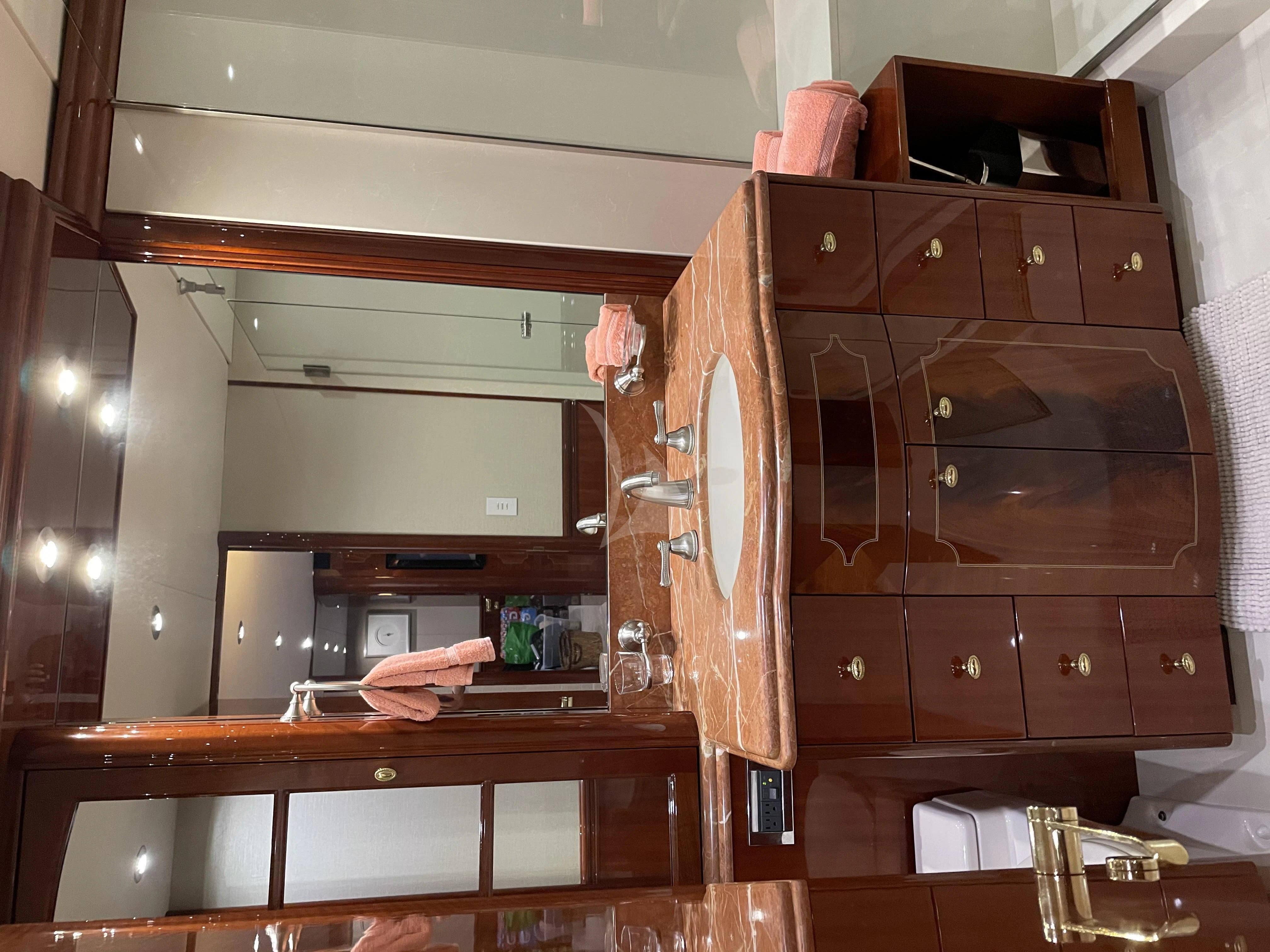 a room with a cabinet and a mirror aboard CENTER RING Yacht for Sale