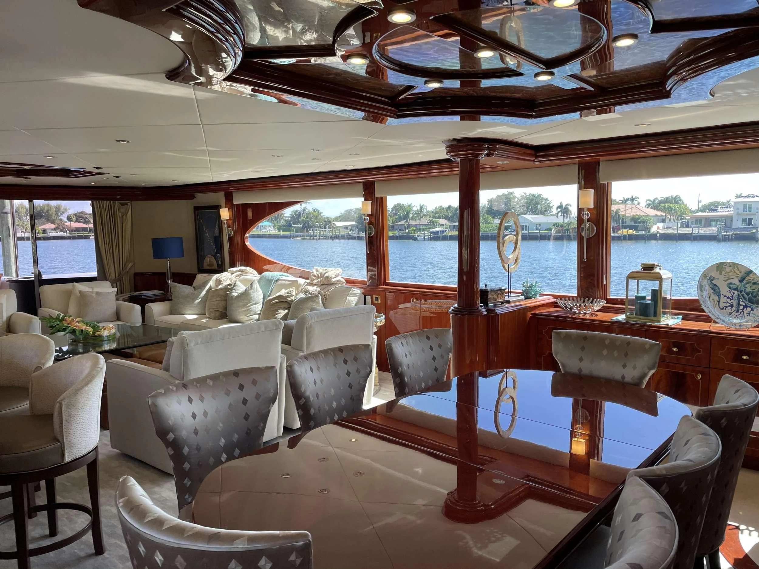 a boat with a table and chairs aboard CENTER RING Yacht for Sale