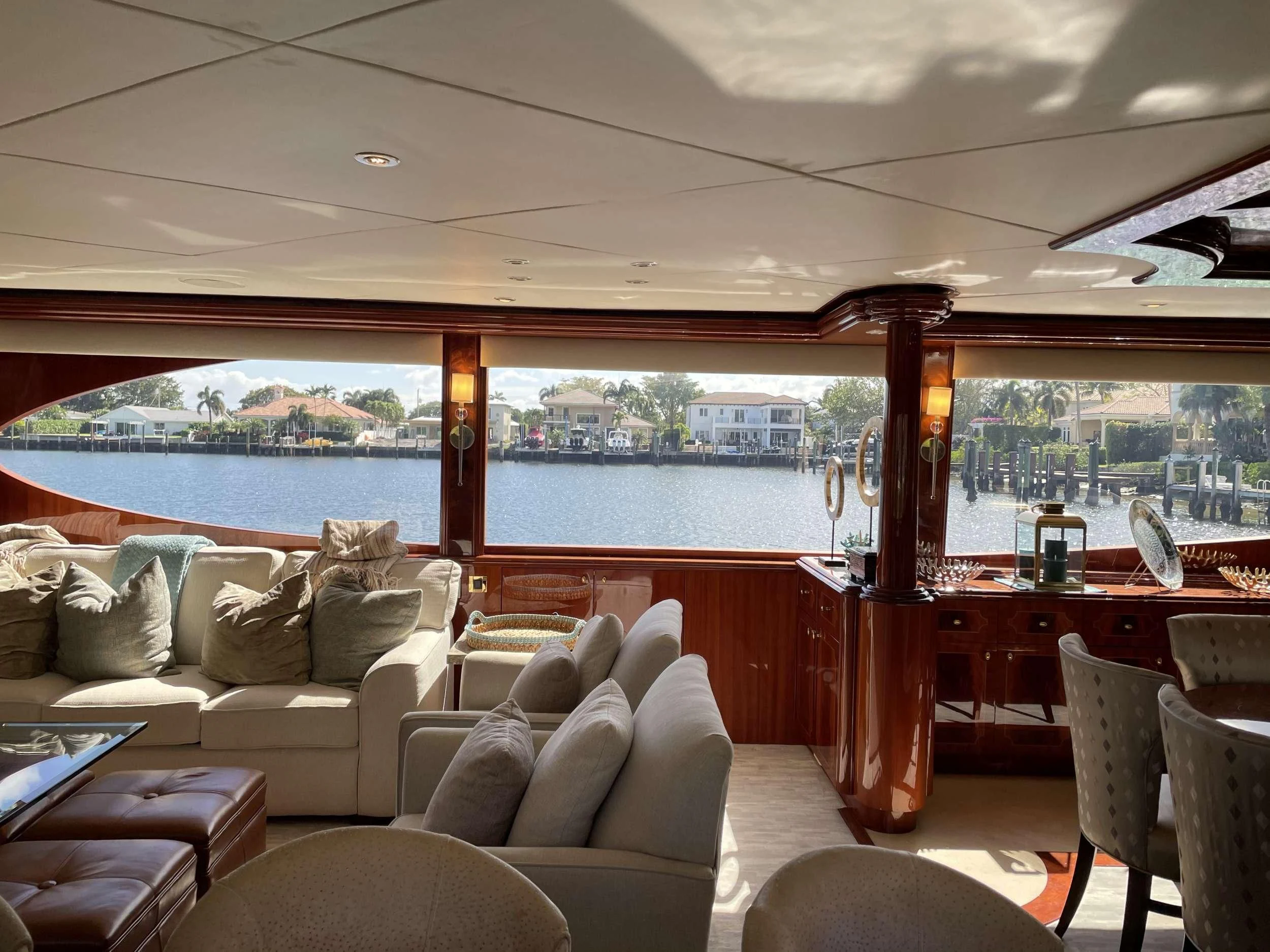 a living room with a large window aboard CENTER RING Yacht for Sale