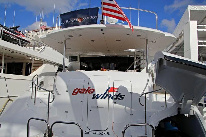 a white airplane with a flag on the front aboard CENTER RING Yacht for Sale