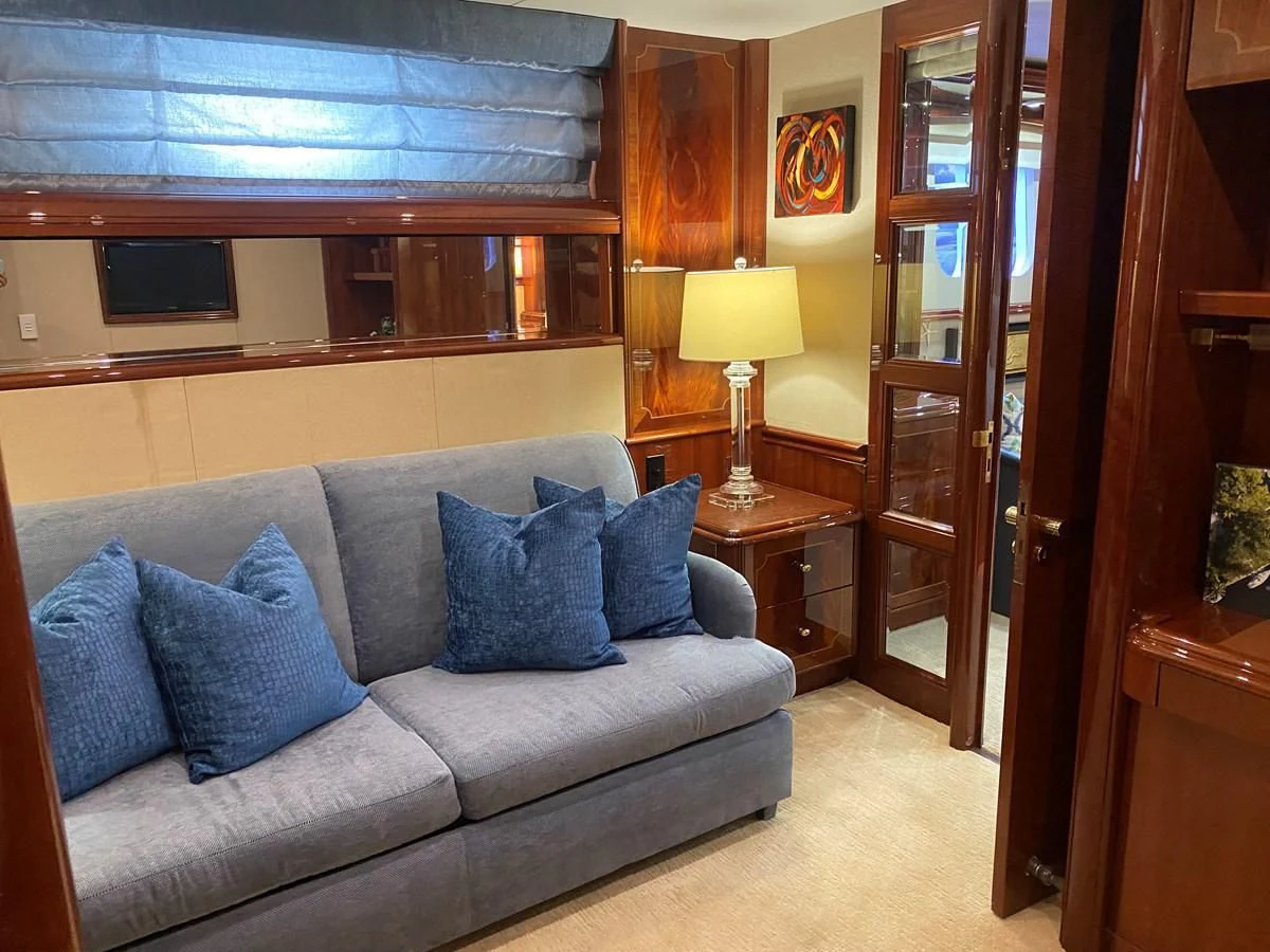 a couch in a room aboard CENTER RING Yacht for Sale