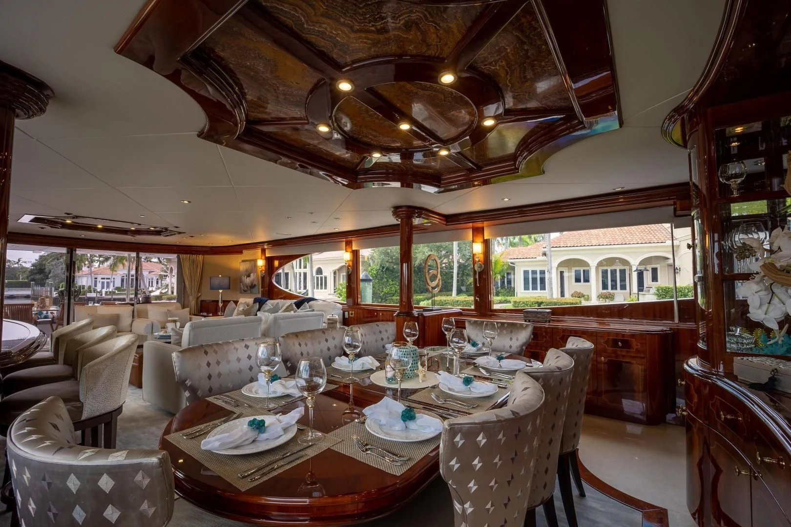 a large dining room with a large chandelier aboard CENTER RING Yacht for Sale