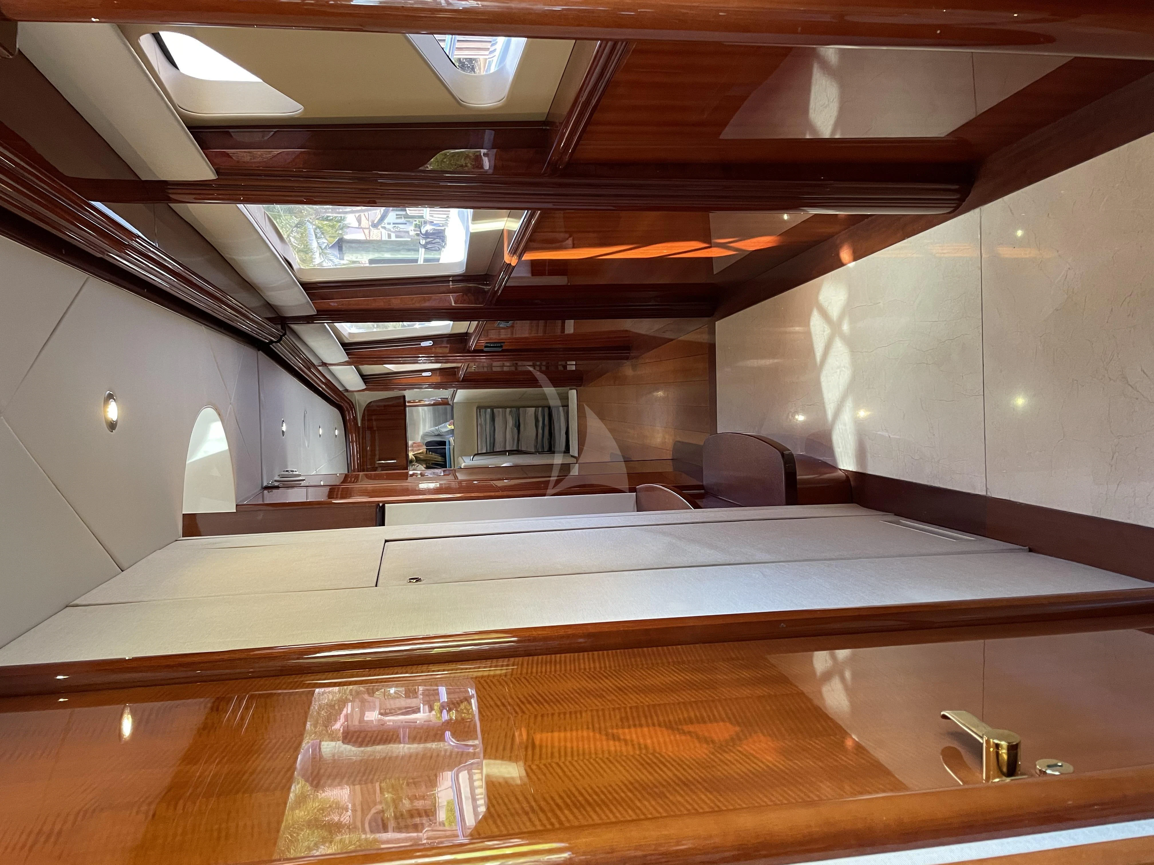a room with a table and chairs aboard CENTER RING Yacht for Sale