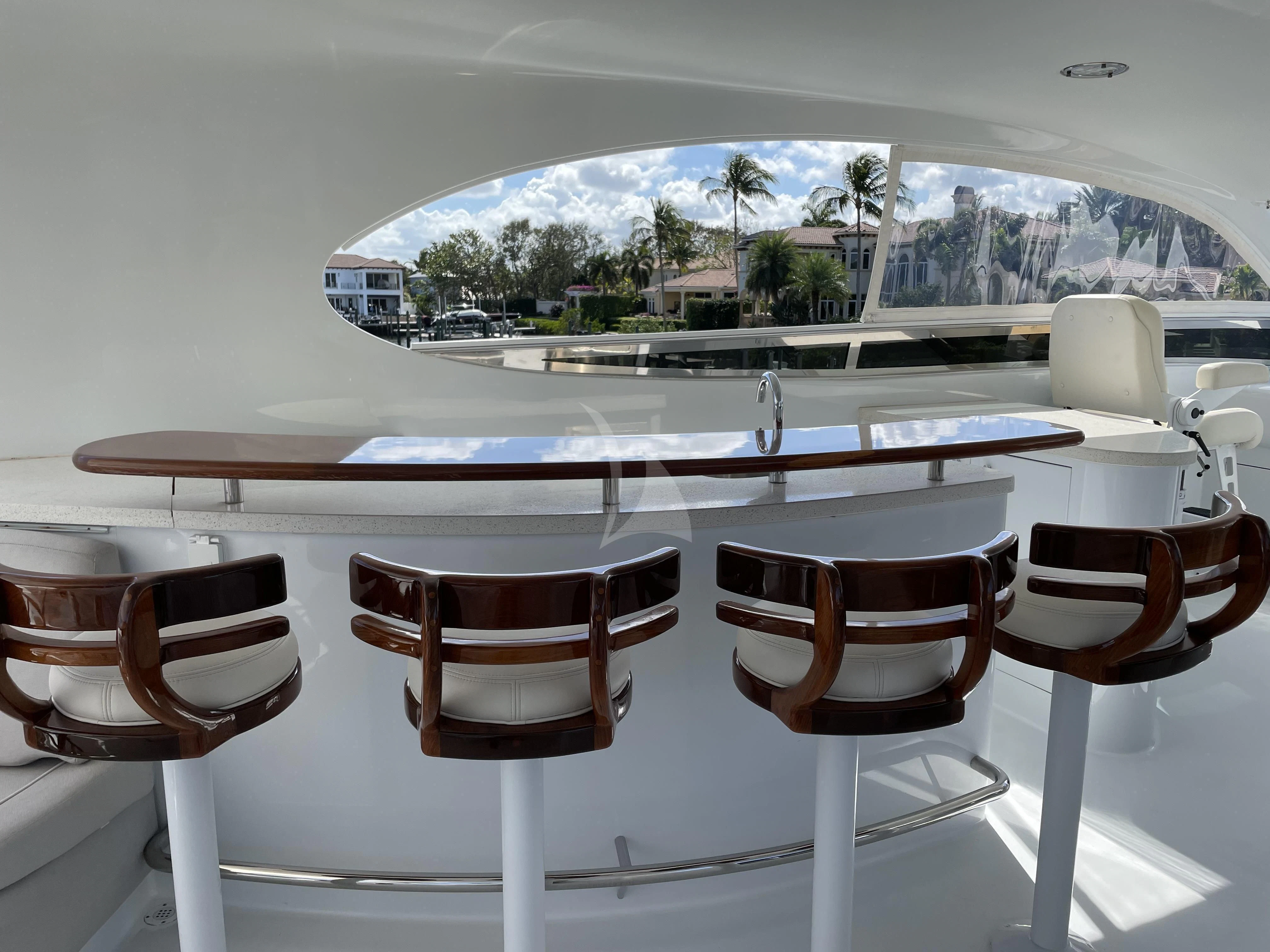 a table with chairs around it aboard CENTER RING Yacht for Sale