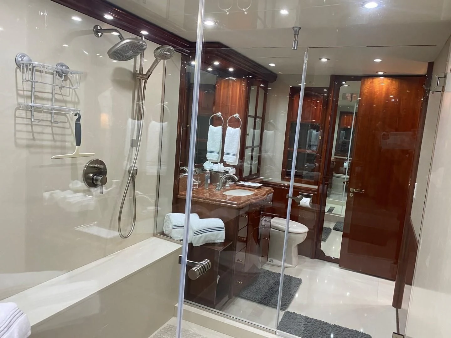 a bathroom with a shower and sink aboard CENTER RING Yacht for Sale