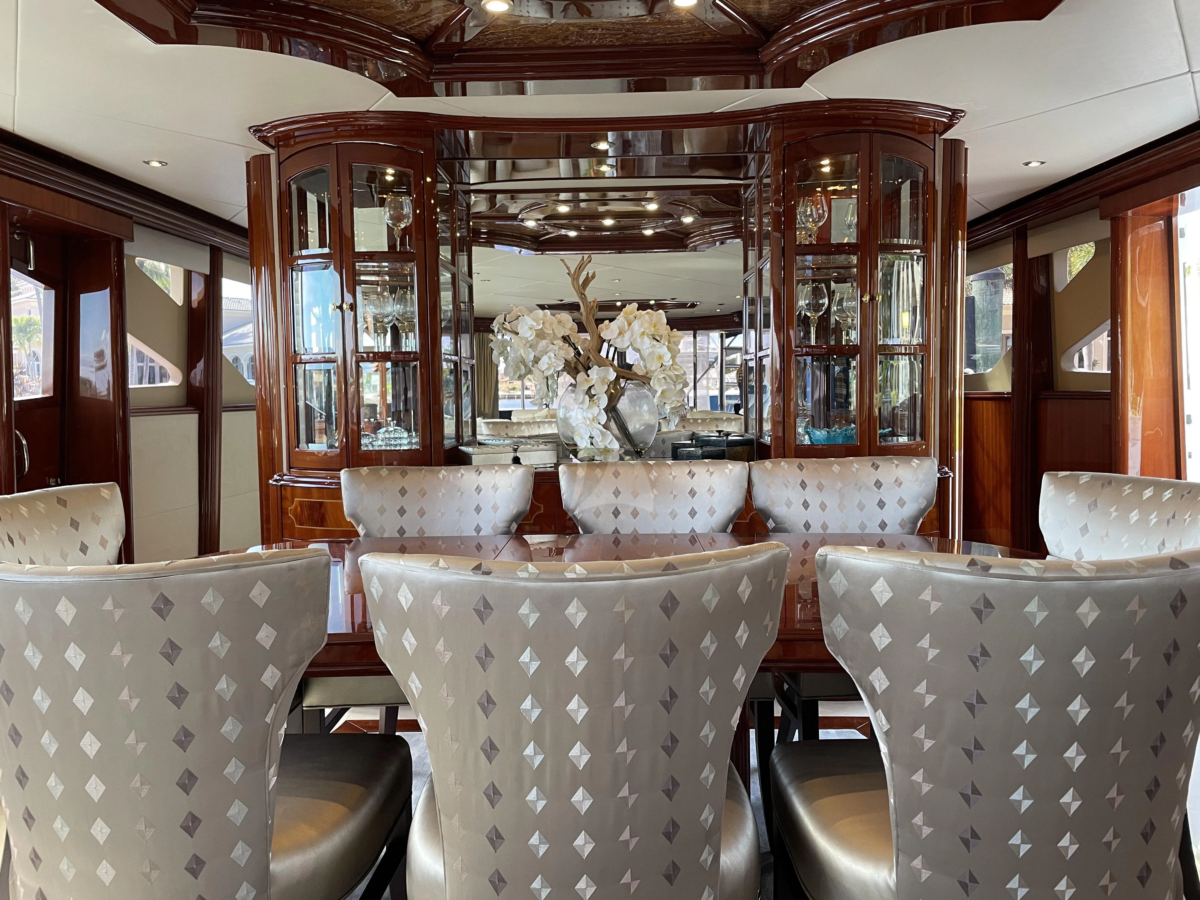 a room with chairs and a table aboard CENTER RING Yacht for Sale