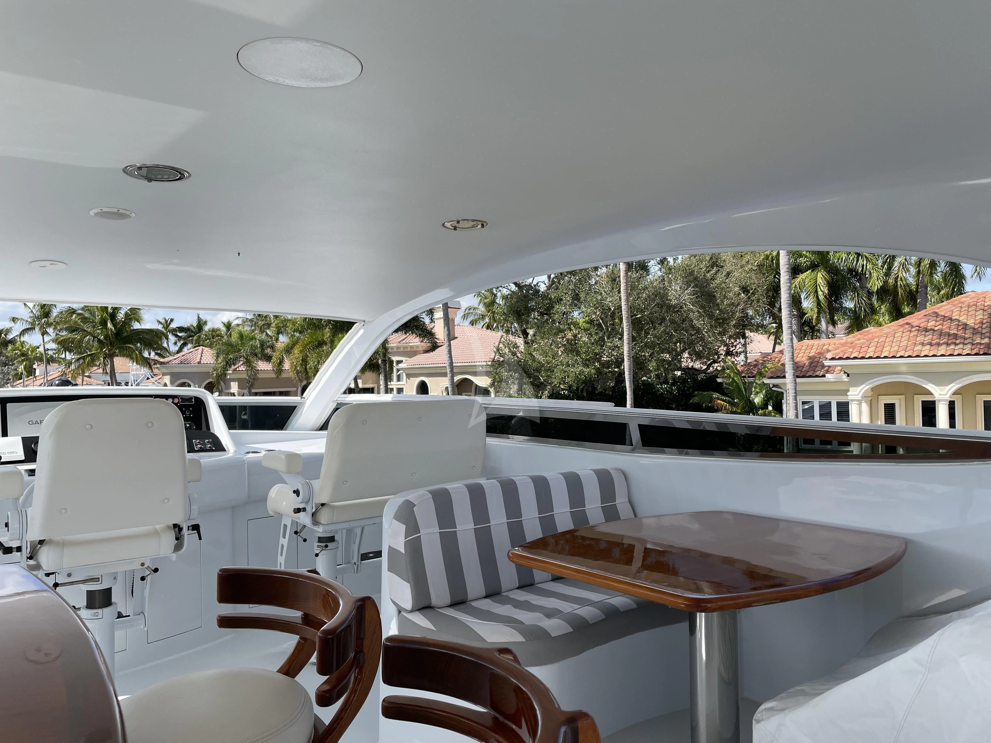 a table and chairs on a boat aboard CENTER RING Yacht for Sale