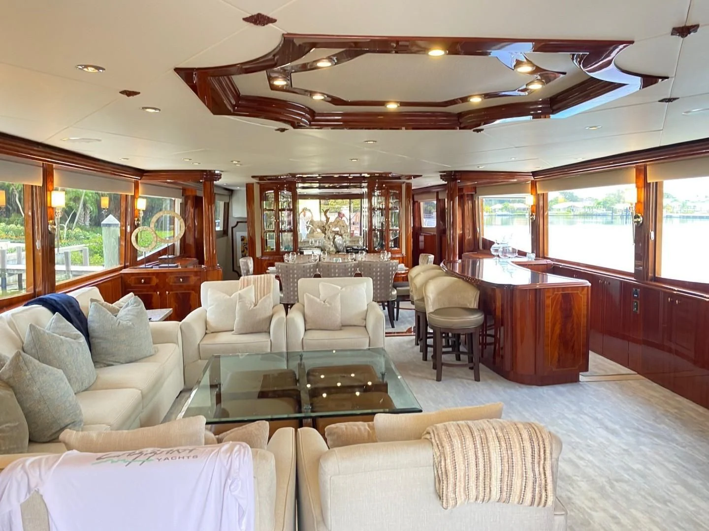 a room with a table chairs and a couch aboard CENTER RING Yacht for Sale