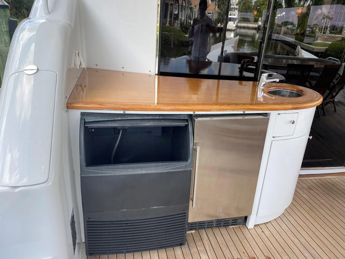 a kitchen with a microwave and a sink aboard CENTER RING Yacht for Sale