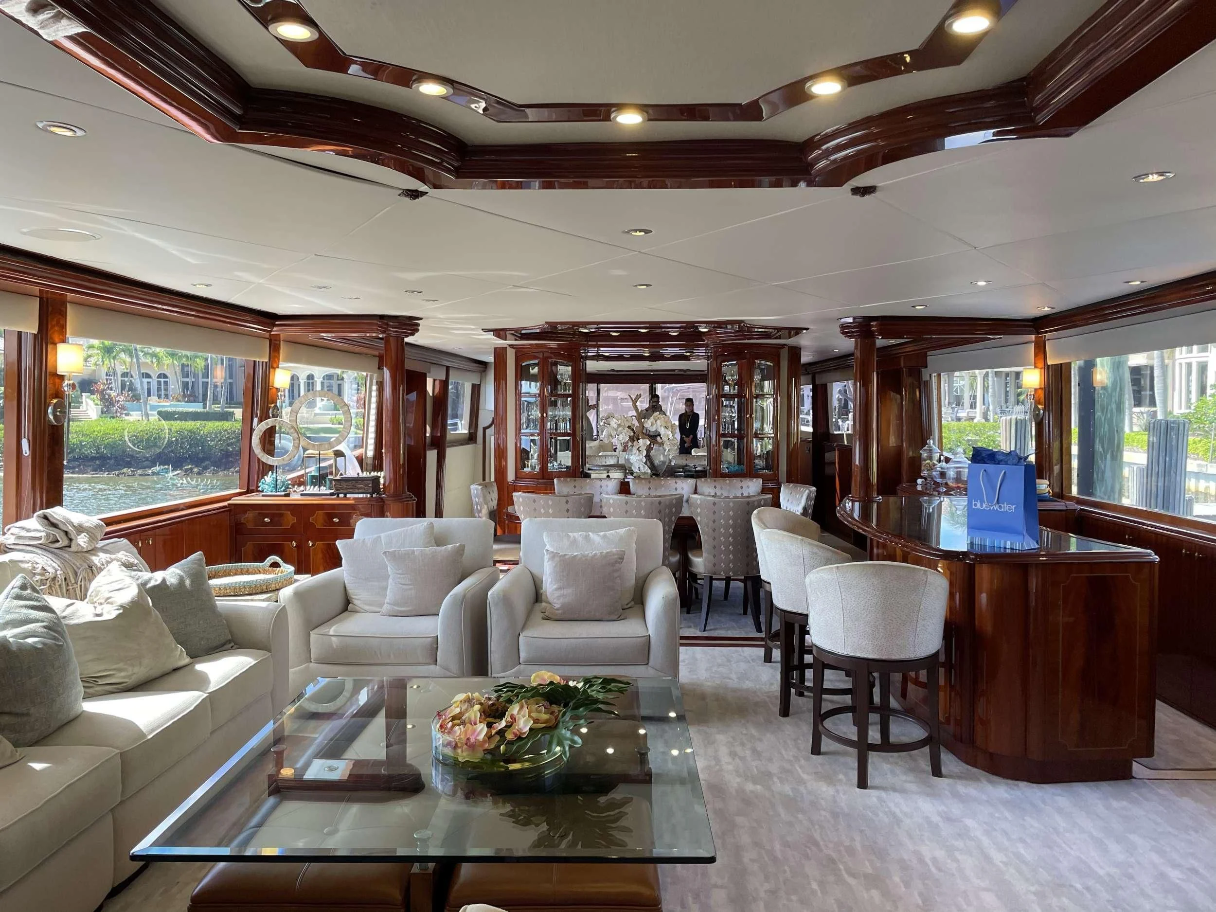 a living room with a large window aboard CENTER RING Yacht for Sale