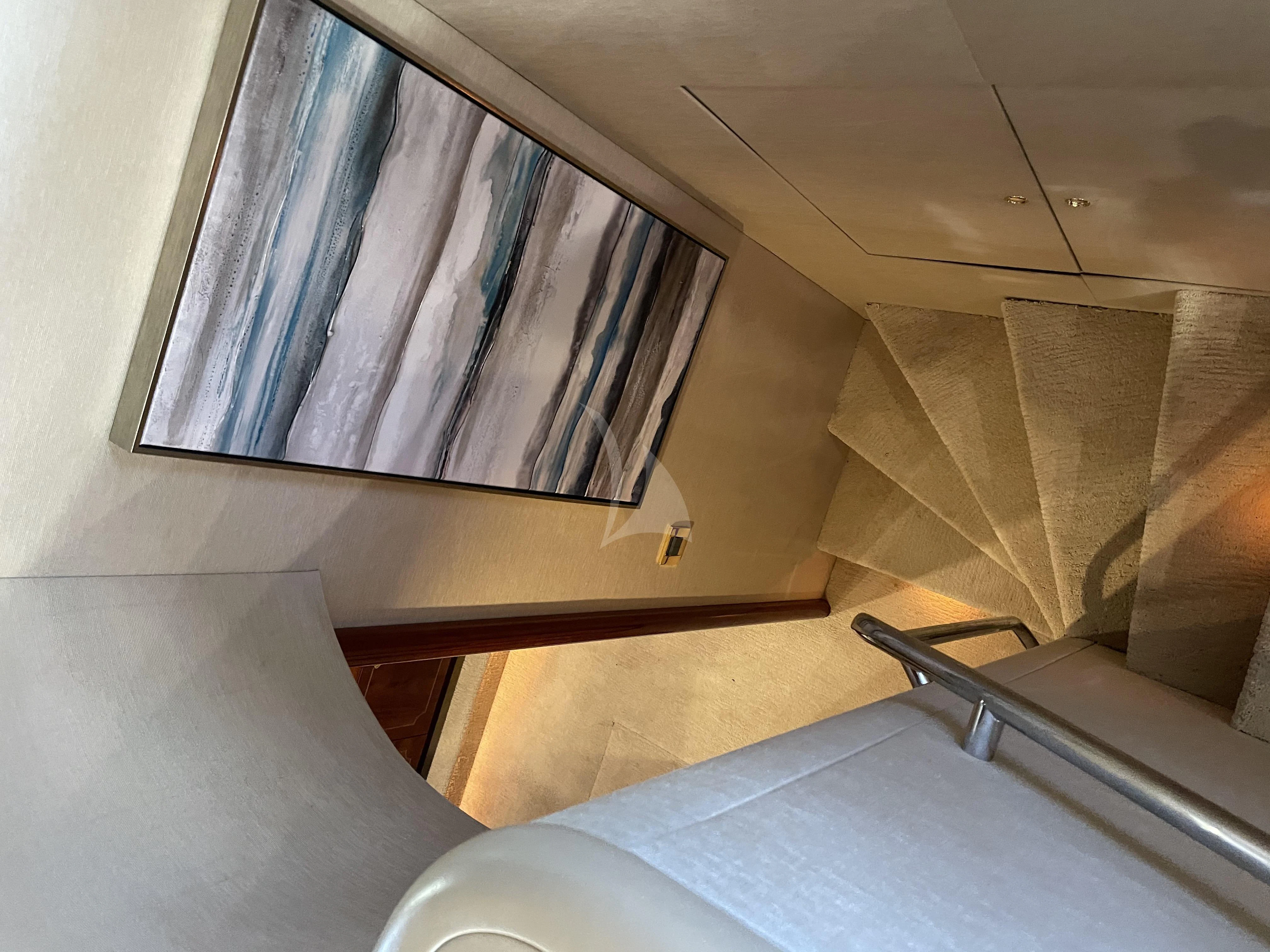 a room with a bed and a chair aboard CENTER RING Yacht for Sale