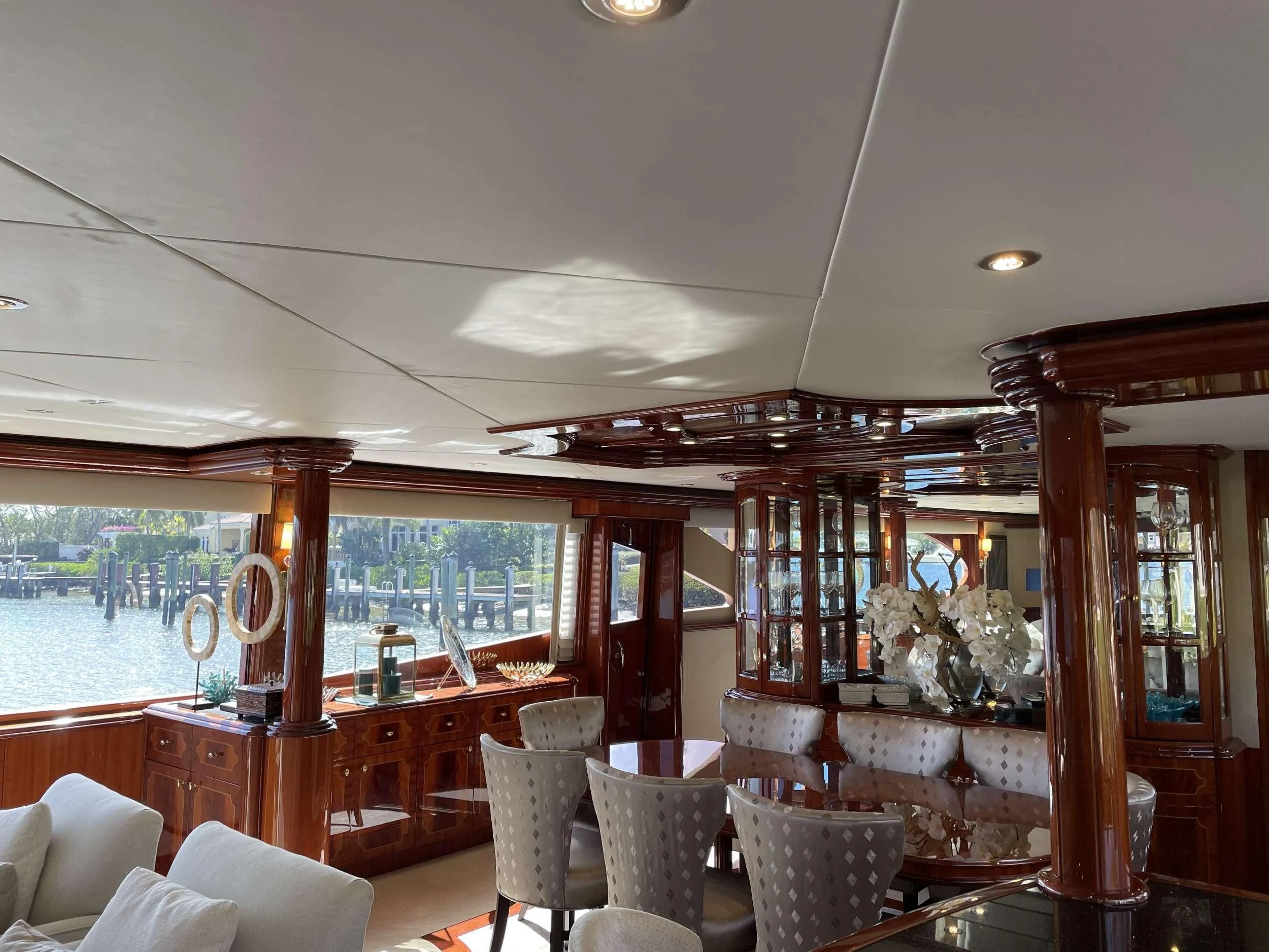 a room with a table chairs and a window aboard CENTER RING Yacht for Sale