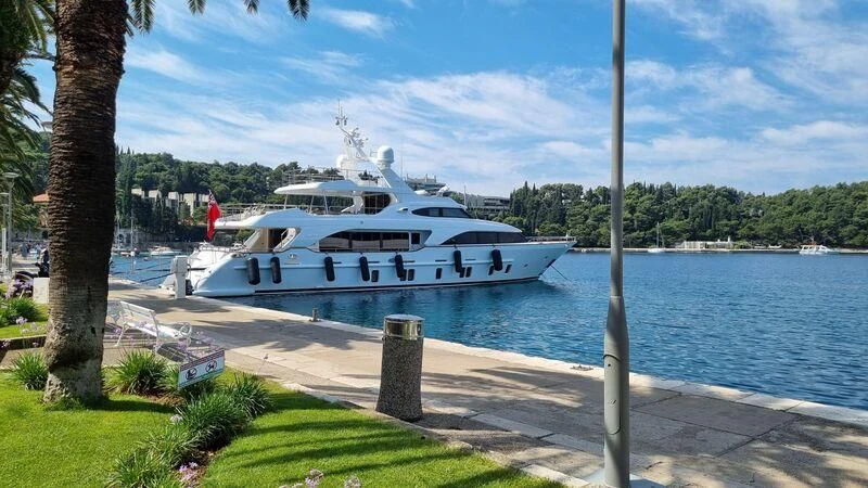 a boat parked on a dock aboard MIAMAA Yacht for Sale