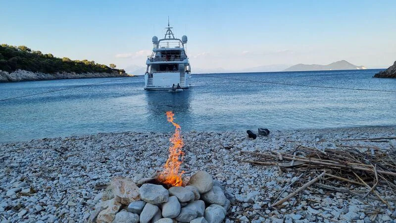 a fire on the beach aboard MIAMAA Yacht for Sale