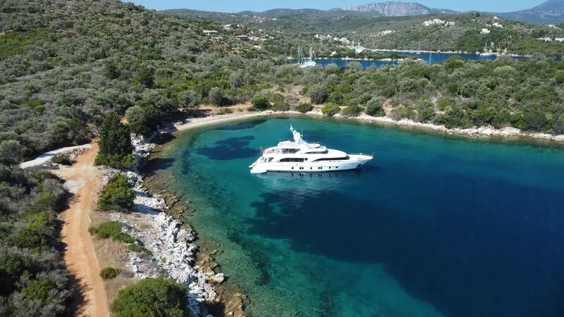 a boat sailing on a river aboard MIAMAA Yacht for Sale