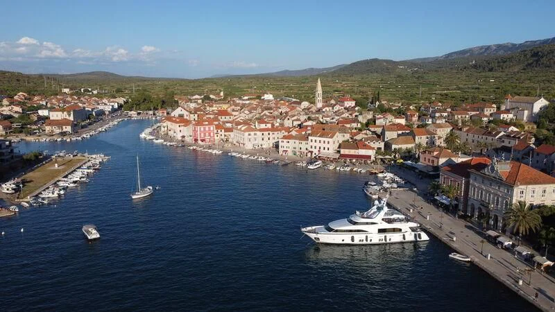 a body of water with boats and buildings along it aboard MIAMAA Yacht for Sale