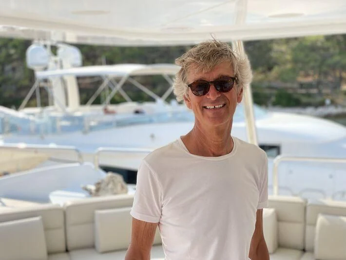 a smiling woman wearing sunglasses aboard MIAMAA Yacht for Sale