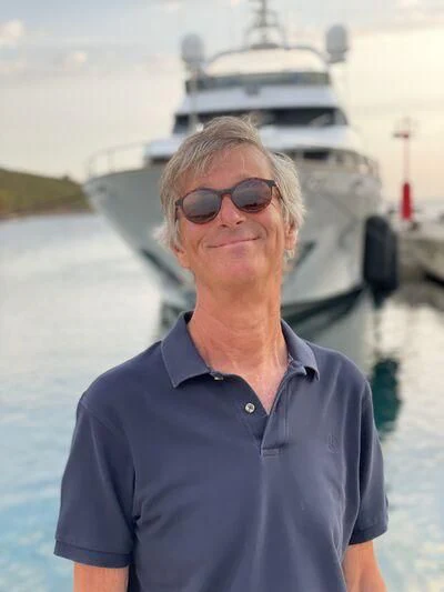 a person standing in front of a ship aboard MIAMAA Yacht for Sale