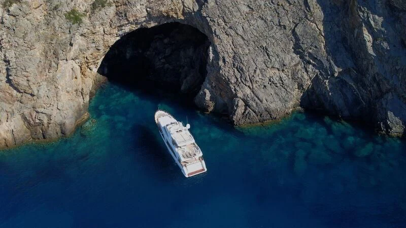 a small boat in a body of water aboard MIAMAA Yacht for Sale