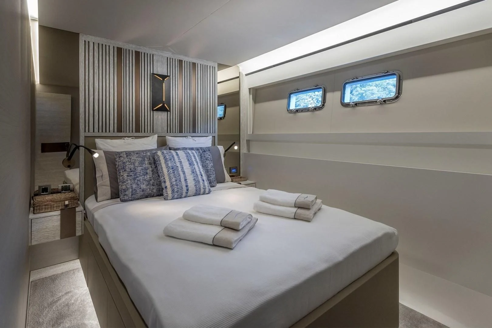 a bed with a white bed spread aboard NUMARINE 26XP/24 Yacht for Sale